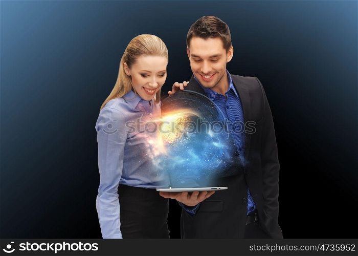 business, future technology and people concept - businessman and businesswoman with tablet pc computer and planet hologram over dark blue background. businesspeople with tablet pc and planet hologram. businesspeople with tablet pc and planet hologram