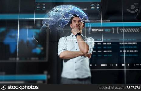 business, future technology and people concept - businessman looking at earth projection virtual screen at night office. businessman at virtual screen at night office