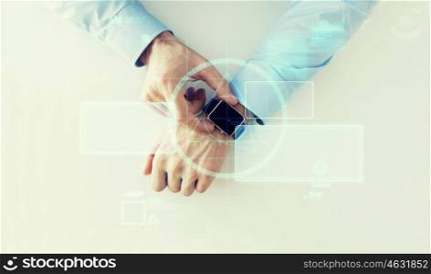 business, future technology and people concept - close up of male hands setting smart watch with virtual screens projection