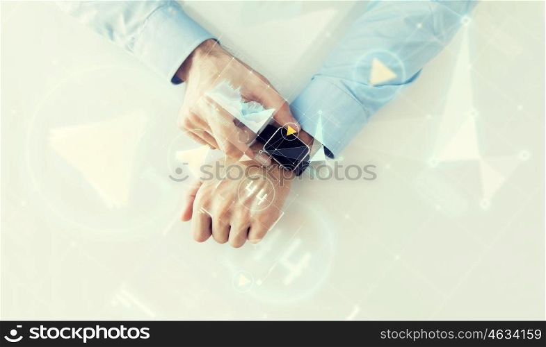 business, future technology and people concept - close up of male hands setting smart watch with virtual screens and charts projection