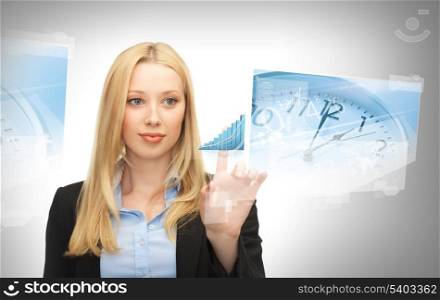 business, future technology and time management concept - businesswoman pointing at graph on virtual screen