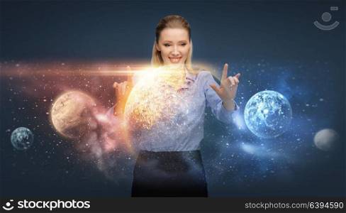 business, future technology, augmented reality and people concept - happy smiling businesswoman with virtual planets and space hologram. happy businesswoman with virtual planets and space