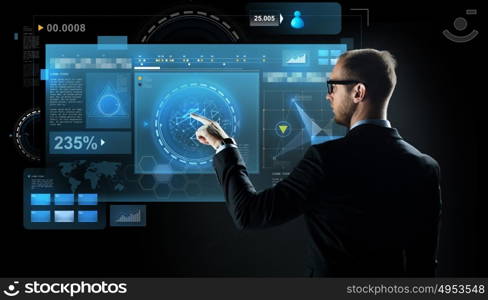 business, future technology, cyberspace and people - businessman in suit and glasses pointing finger to virtual screen projection over black background. businessman pointing finger to virtual screen