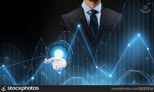business, future technology, cyberspace and people - businessman with virtual diagram chart projection over black background. businessman with virtual diagram chart projection