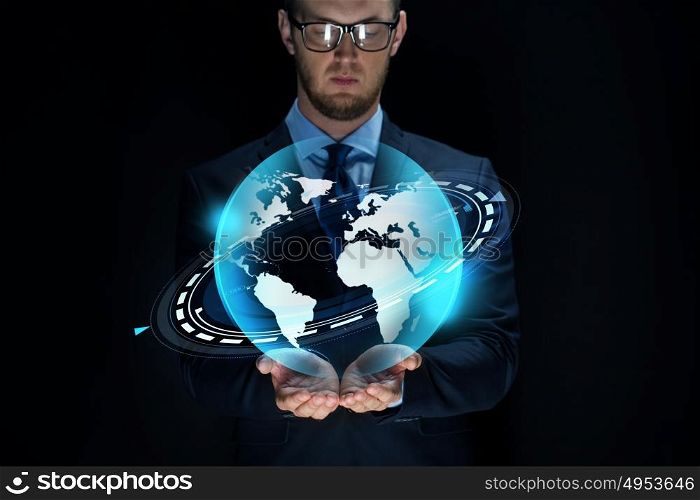 business, future technology, mass media, cyberspace and people - businessman with virtual earth projection over black background. businessman with virtual earth projection