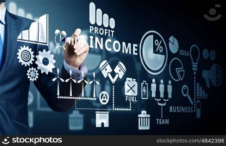 Business futuristic concept. Close up of businessman drawing strategy plan on media screen