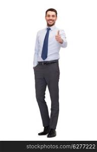 business, gesture and office concept - handsome businessman showing thumbs up