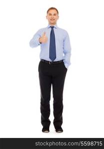 business, gesture and office concept - smiling businessman showing thumbs up standing full-length