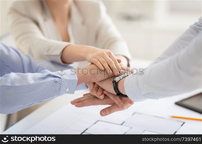 business, gesture and teamwork concept - close up of businesspeople or architects stacking hands. close up of business team stacking hands