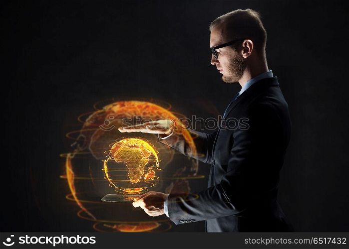 business, globalization and future technology concept - businessman with transparent tablet pc computer and earth hologram over black. businessman with tablet pc and earth hologram. businessman with tablet pc and earth hologram