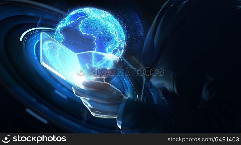 business, globalization and future technology concept - close up of businessman hands with transparent tablet pc computer and earth hologram over black. businessman with tablet pc and earth hologram. businessman with tablet pc and earth hologram