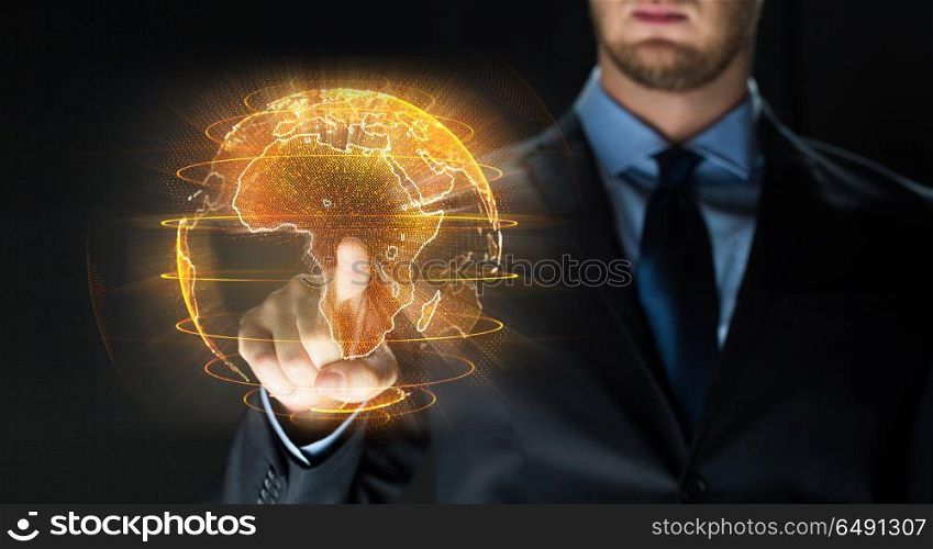 business, globalization and future technology concept - close up of businessman with earth hologram over black. close up of businessman with earth hologram. close up of businessman with earth hologram