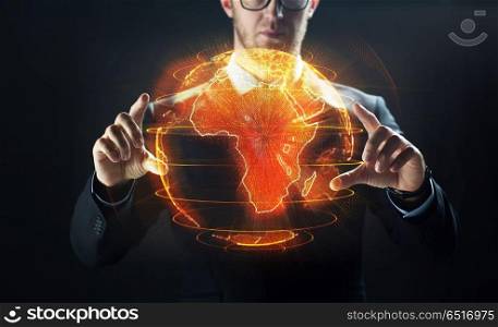 business, globalization and future technology concept - close up of businessman with earth hologram over black. close up of businessman with earth hologram. close up of businessman with earth hologram
