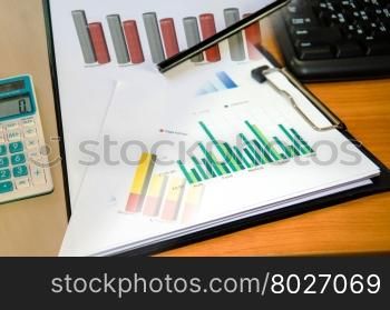 Business graphs and pen analysis report. Accounting.Business Concept