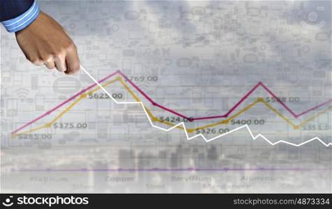 Business growth. Hand of businessman drawing with pencil increasing graph