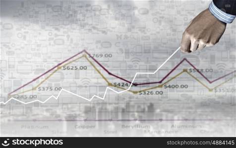Business growth. Hand of businessman drawing with pencil increasing graph
