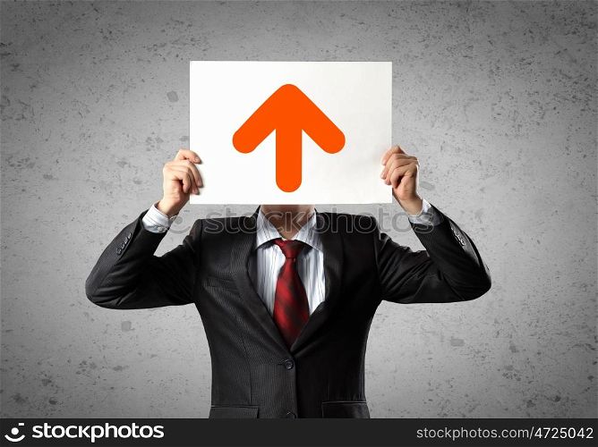 Business growth. Image of man holding board with arrow picture