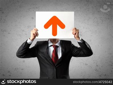 Business growth. Image of man holding board with arrow picture