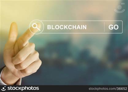 business hand clicking blockchain button on search toolbar with vintage style effect