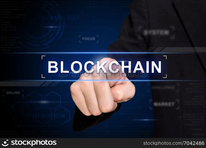 business hand clicking blockchain button on virtual screen
