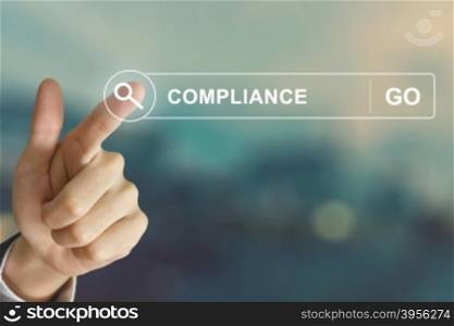business hand clicking compliance button on search toolbar with vintage style effect