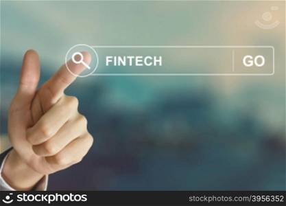 business hand clicking fintech or financial technology button on search toolbar with vintage style effect