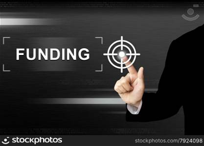 business hand clicking funding button on a touch screen interface