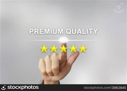 business hand clicking premium quality with five stars on screen