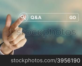 business hand clicking Q&amp;A or Question and Answer button on search toolbar with vintage style effect