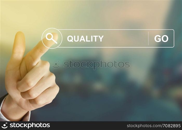 business hand clicking quality button on search toolbar with vintage style effect
