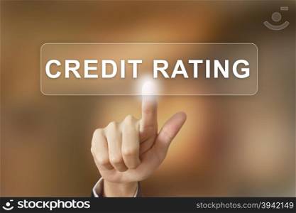 business hand pushing credit rating button on blurred background
