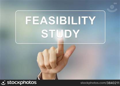 business hand pushing feasibility study button on blurred background