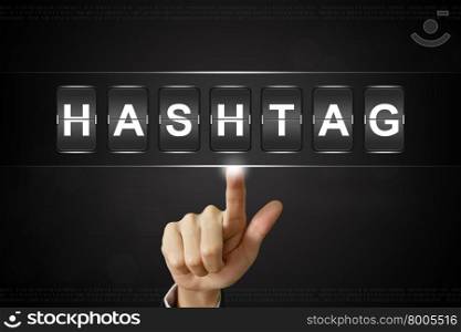 business hand pushing hashtag on Flipboard Display