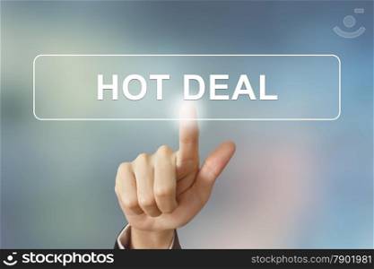 business hand pushing hot deal button on blurred background