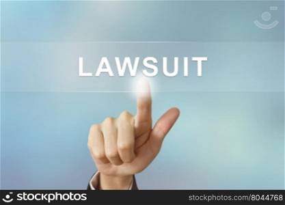 business hand pushing lawsuit button on blurred background