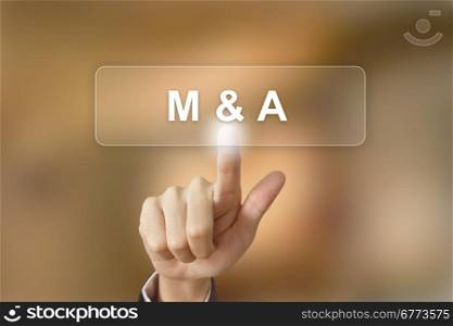 business hand pushing merger and acquisition button on blurred background