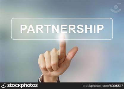 business hand pushing partnership button on blurred background