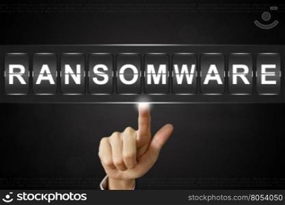 business hand pushing ransomware on Flipboard Display