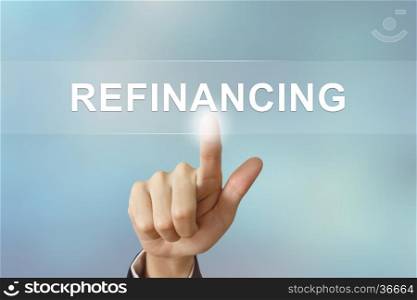 business hand pushing refinancing button on blurred background