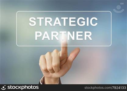 business hand pushing strategic partner button on blurred background