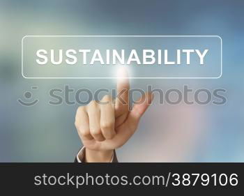 business hand pushing sustainability button on blurred background