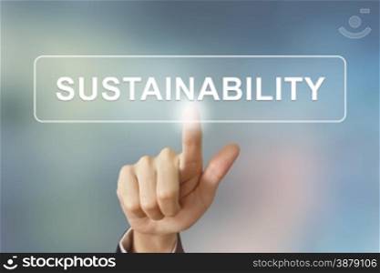 business hand pushing sustainability button on blurred background