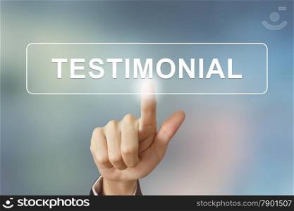 business hand pushing testimonial button on blurred background