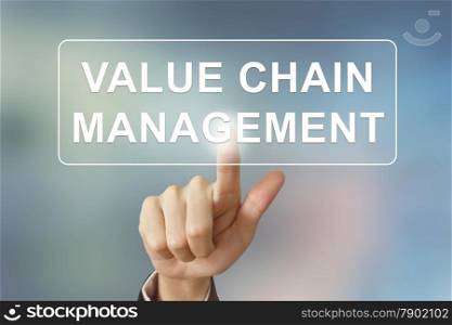 business hand pushing value chain management button on blurred background