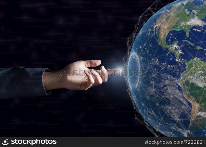 Business hand touching global network and data exchanges over the world on dark . Elements of this image furnished by NASA