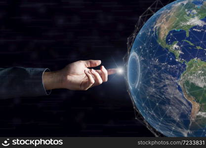 Business hand touching global network and data exchanges over the world on dark . Elements of this image furnished by NASA