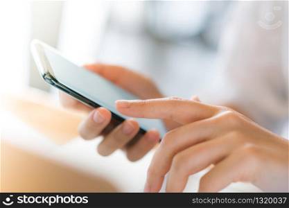 Business hand with mobile phone