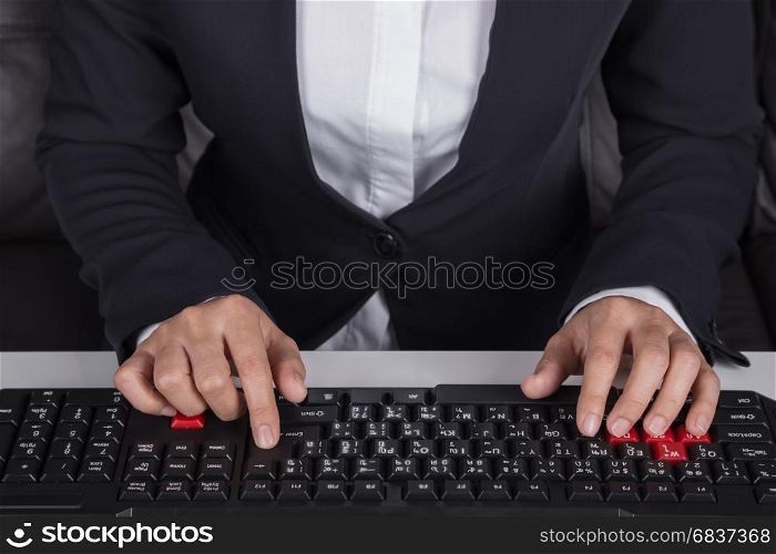 business hands typing on computer keyboard