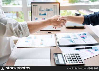 Business handshake after agreement meeting or negotiation finishing up dealing project, partnership approval and deal concept