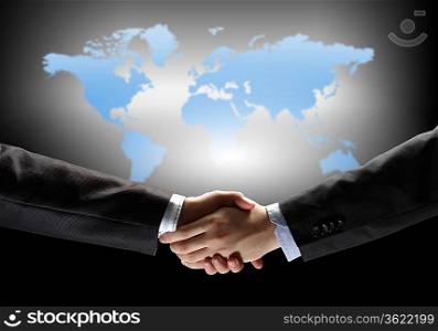 business handshake against black background with map image